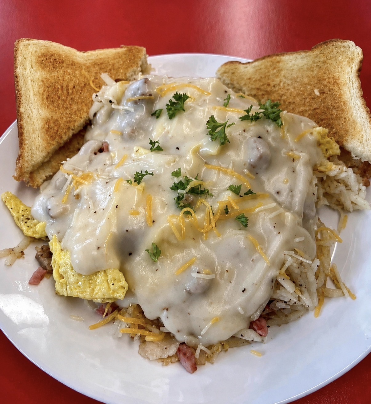 A hot open-faced diner special with melted cheese